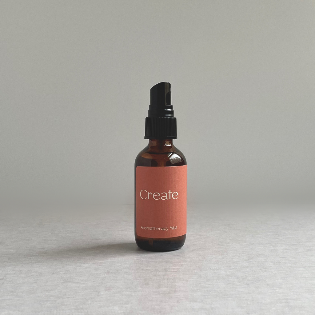 Species by the Thousands aromatherapy spray for creativity with orange label.