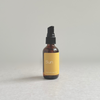 Species by the Thousands Sun Aromatherapy Mist in an amber glass bottle with mustard yellow  label.