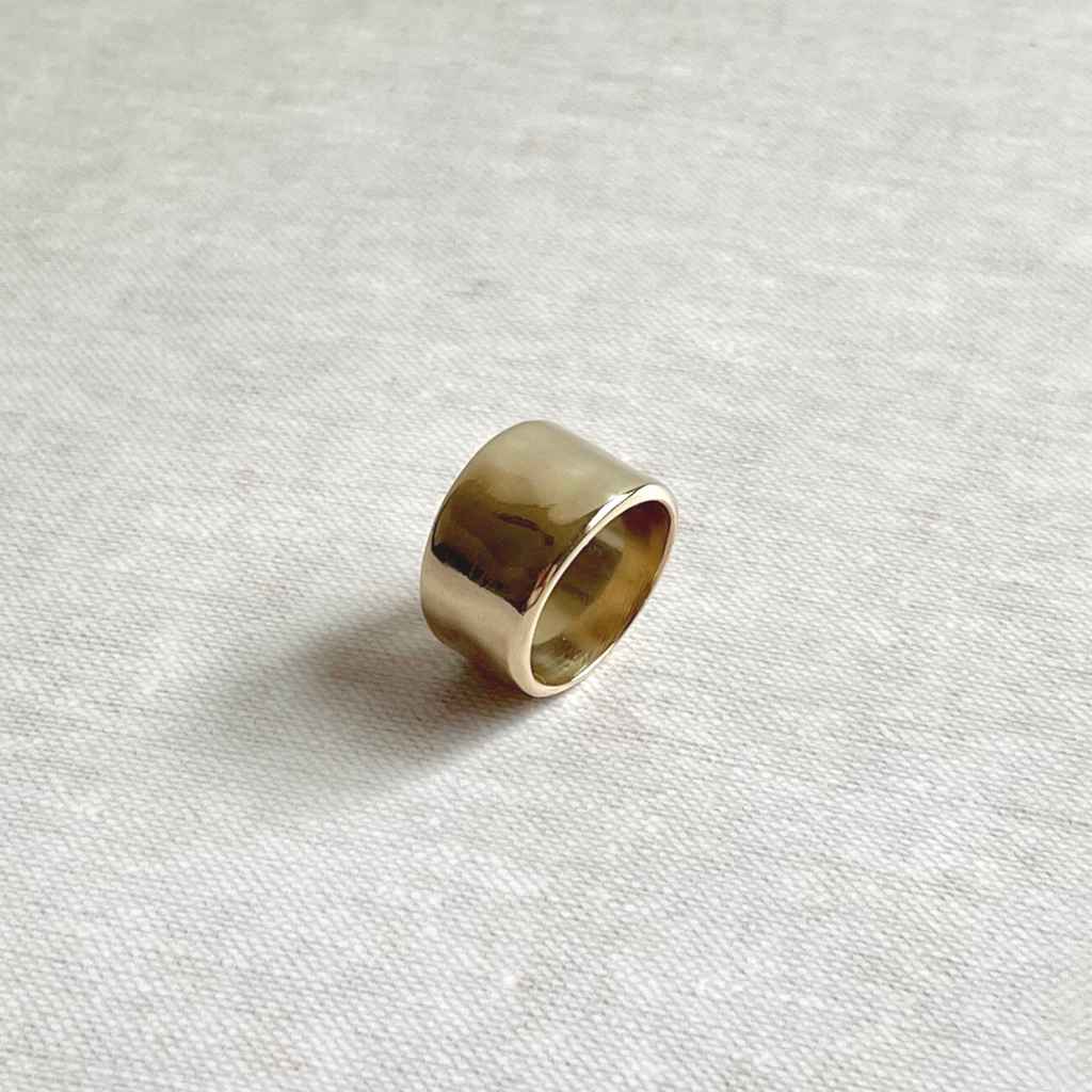 Species by the Thousands wide band River ring in brass.