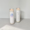 Species by the Thousands Magic Scrying Candle and Magic Sigil Candle with minimal white labels with holographic designs.